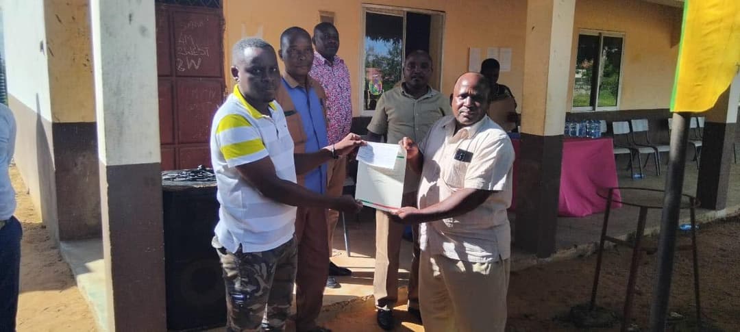students in Ganze receiving bursary cheques